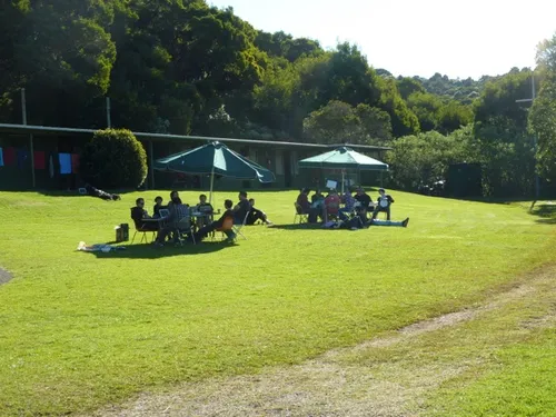 A photo taken at CampJS, showing a group of people sitting at a picnic table