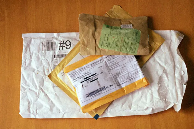 Photo of a collection of padded post packs sent from China.