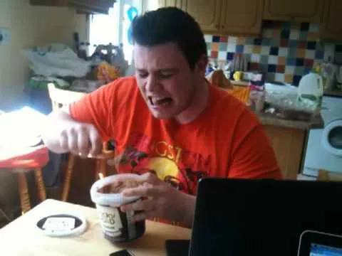 A photo of a software developer crying and eating ice cream while watching how to stop sucking and be awesome instead.