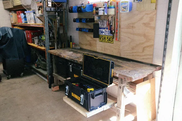 Workbench with draw slid open and toolbox open.