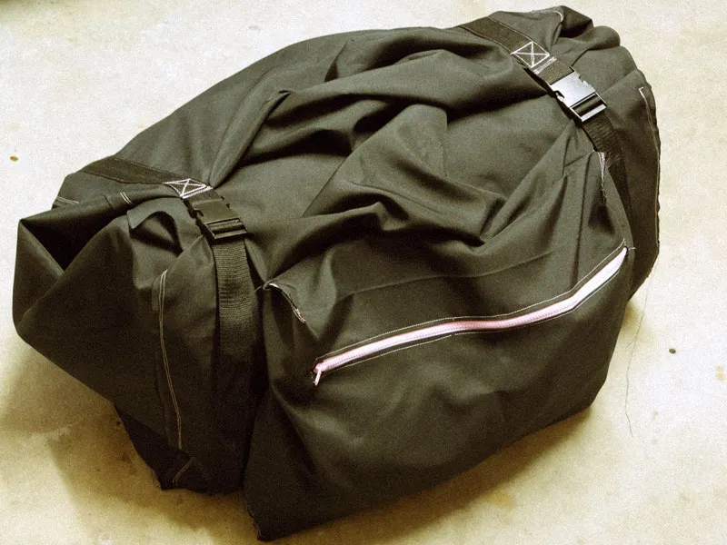 Large duffle bag for carrying an inflatable raft.