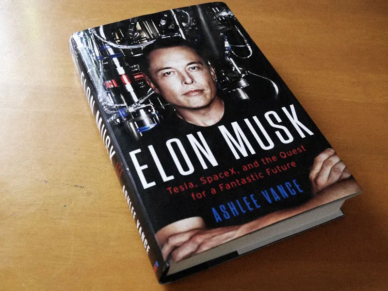 Photo of the book 'Elon Musk: Tesla, SpaceX and The Quest for a Fantastic Future' on the top of a table.