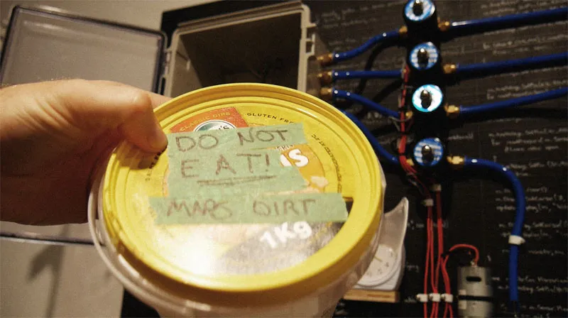 Air-tight container filled with simulant mars dirt. Labelled do not eat, mars dirt.