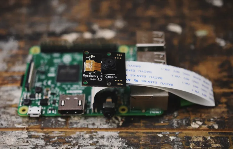 A photo of a Raspberry Pi NOIR camera module, v1.3 attached to a Raspberry Pi V3.