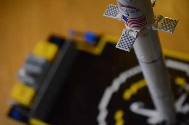 Close up of landed lego falcon 9 on autonomous spaceport drone ship.