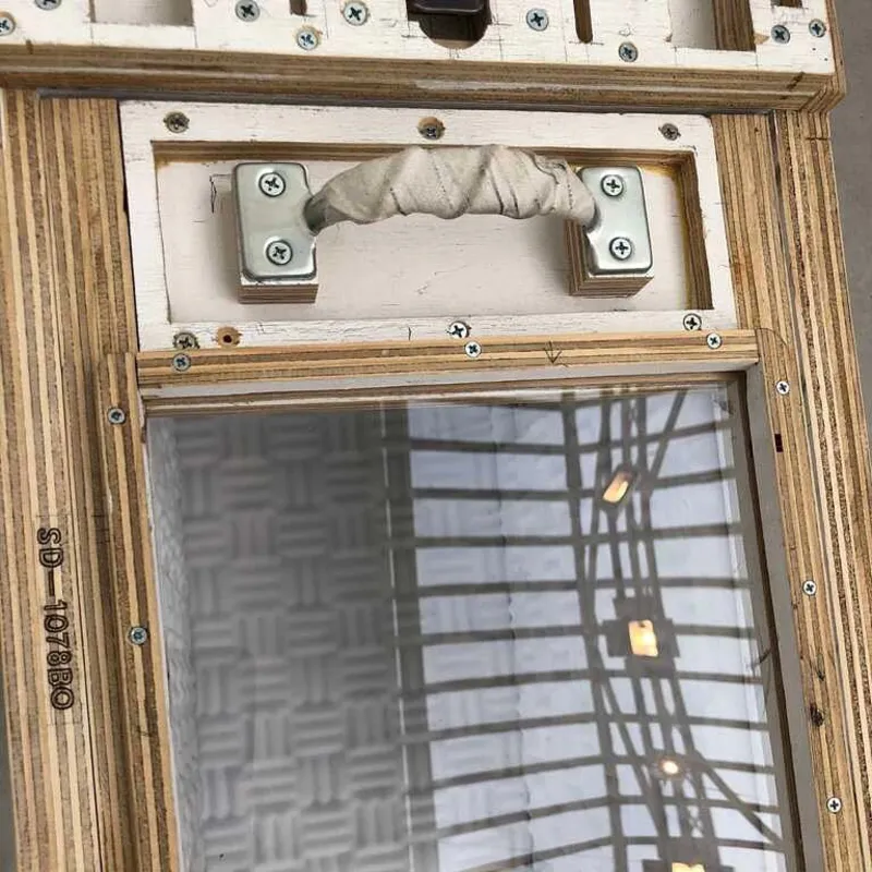 A picture of the handle on the alien cat carrier made by Tom Sachs.