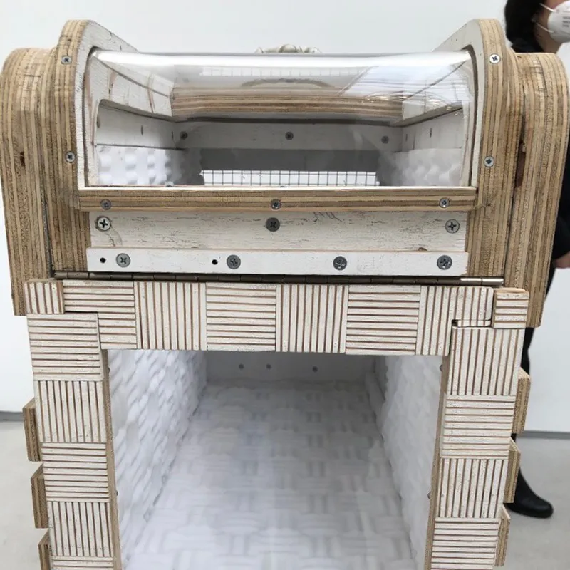 A picture of the door on the alien cat carrier made by Tom Sachs.