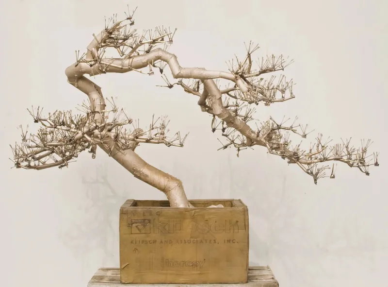 A photo of the bronze bonzai by Tom Sachs.