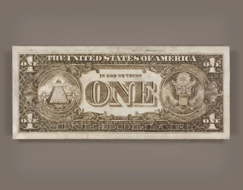 A woodburnt US dollar bill by Tom Sachs.
