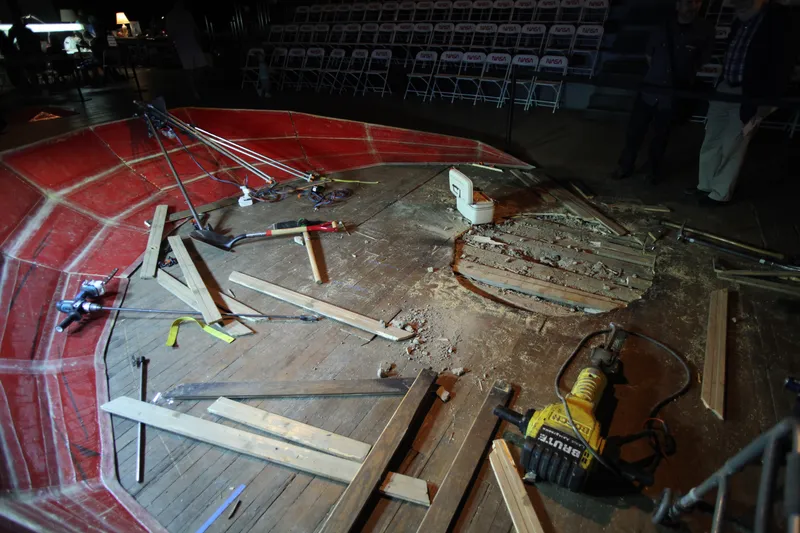 A photo of the hole in the floor of the park avenue armory after Tom Sachs' Space Program.