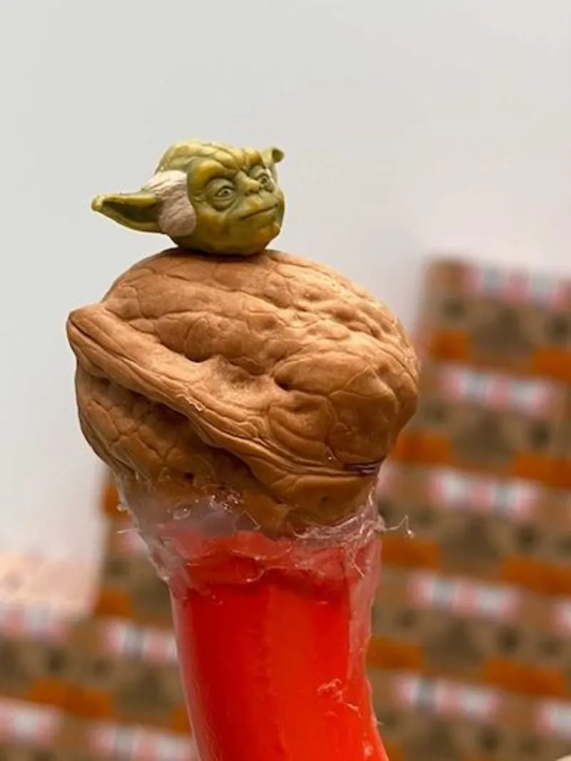 A close up photo of yoda piloting the red solar barge sculpture created by Tom Sachs and installed at Deichtorhallen, Germany