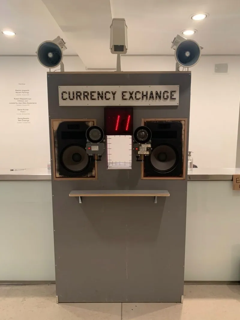 A photo of the currency exchange kiosk by Tom Sachs.