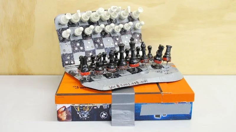 A photo of the apollo program themed Chess set by Tom Sachs.