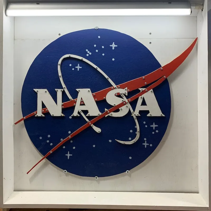 A photo of the NASA meatball logo made out of plywood by Clinton Freeman
