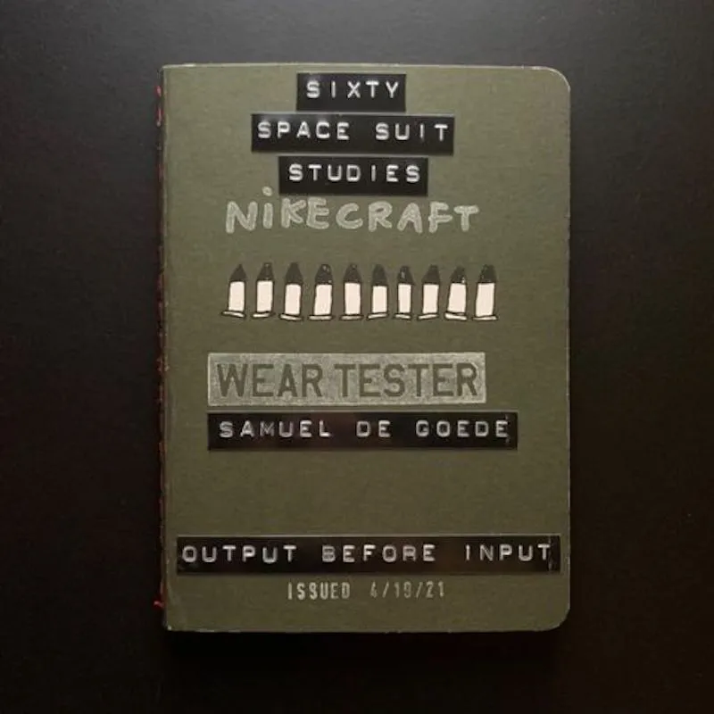 A photo of the cover of a notebook containing 60 space suit studies by Samuel De Goede.